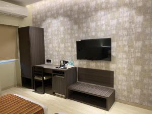 TV a/nebo společenská místnost v ubytování Hotel Landmark Fort