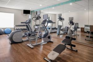 a gym with several treadmills and exercise bikes at Holiday Inn Express & Suites Graham, an IHG Hotel in Graham