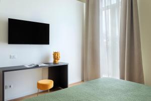 TV a/nebo společenská místnost v ubytování Mori's Rooms