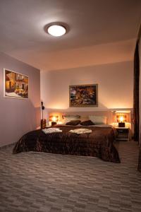 Postel nebo postele na pokoji v ubytování Kalypso Hotel