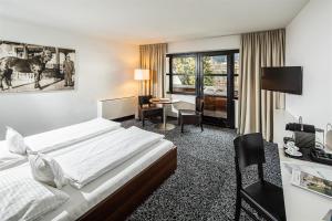 Postel nebo postele na pokoji v ubytování Geniesserhotel Rauter