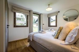 Posteľ alebo postele v izbe v ubytovaní Chalet Flocons de Neige