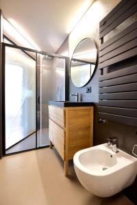 a bathroom with a sink and a mirror at LANCETTI Stylish Loft - hosted by Sweetstay in Milan