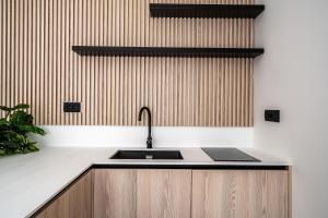 a kitchen with a sink and a counter top at Blanche Cliff Apartments in Sveti Stefan