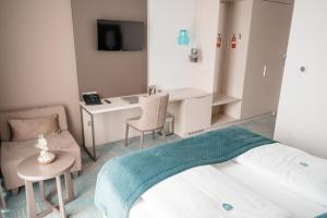 Postel nebo postele na pokoji v ubytování Hotel Seven