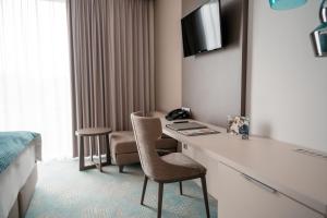TV a/nebo společenská místnost v ubytování Hotel Seven