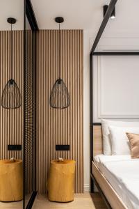 a bedroom with two lamps and a bed at Blanche Cliff Apartments in Sveti Stefan