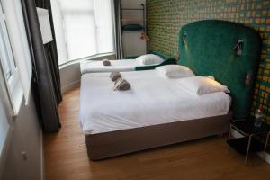 Postel nebo postele na pokoji v ubytování Hotel Kanaï