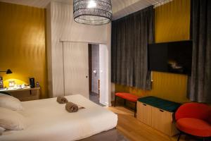Postel nebo postele na pokoji v ubytování Hotel Kanaï
