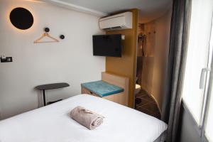 Postel nebo postele na pokoji v ubytování Hotel Kanaï