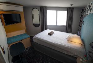 Postel nebo postele na pokoji v ubytování Hotel Kanaï