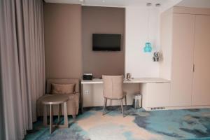 TV a/nebo společenská místnost v ubytování Hotel Seven