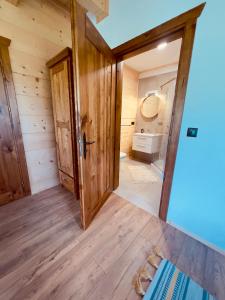 a room with a bathroom with a toilet and a sink at Malinowa Chata in Cisna