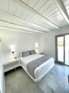 Un pat sau paturi într-o cameră la sun senses luxury Vilas Dione