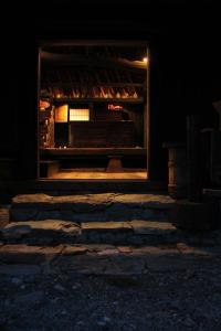 a room with a fireplace in the dark at Chiiori in Miyoshi