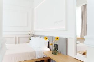 Posteľ alebo postele v izbe v ubytovaní Agora Athens Suites