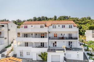 an aerial view of a white apartment building at Apartments Dobrila in Hvar +42 photos