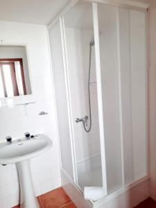 a bathroom with a shower and a sink at Mateus Studios in Vila Nova de Milfontes