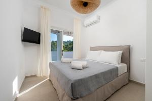 Postel nebo postele na pokoji v ubytování Playia Villas III