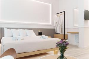 Posteľ alebo postele v izbe v ubytovaní Agora Athens Suites