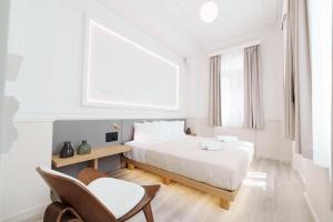 Posteľ alebo postele v izbe v ubytovaní Agora Athens Suites