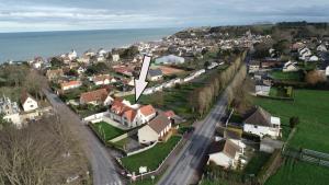 an aerial view of a small town with houses at Villa Tracy in Arromanches-les-Bains