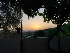 The sunrise or sunset as seen from a panziókat or nearby