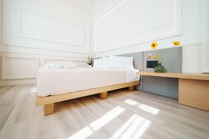 Posteľ alebo postele v izbe v ubytovaní Agora Athens Suites
