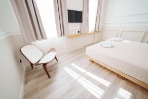 Posteľ alebo postele v izbe v ubytovaní Agora Athens Suites
