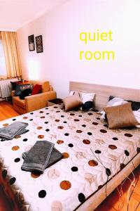 a bedroom with a bed with a quiet room sign on the wall at Borovets Villa Park studio in Borovets