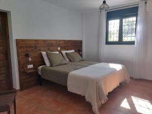 A bed or beds in a room at Casa Loko