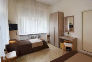 מיטה או מיטות בחדר ב-Hotel La Torre