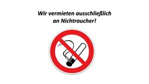 een bord waarop staat: niet roken met een spuit erin bij Appartementhaus Dr Domberg Wohnung 2 in Bad Zwischenahn