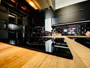 a kitchen with a wooden counter top in a room at Phoenix Garden Apartments -1- in Athens