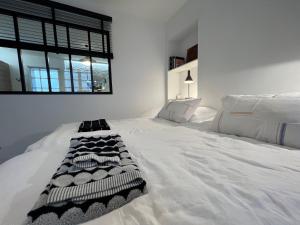 Posteľ alebo postele v izbe v ubytovaní Le Cosy Intra - Appt Cocon Parking privé