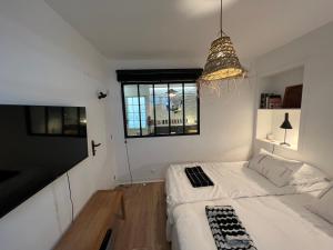 Posteľ alebo postele v izbe v ubytovaní Le Cosy Intra - Appt Cocon Parking privé