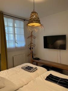 Posteľ alebo postele v izbe v ubytovaní Le Cosy Intra - Appt Cocon Parking privé