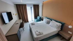 TV a/nebo společenská místnost v ubytování Delight Hotel & SPA