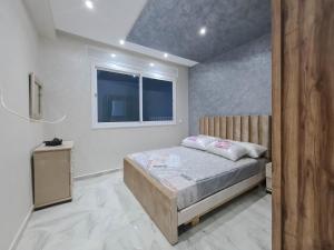 Postel nebo postele na pokoji v ubytování Immeuble Familial Imad