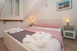 Posteľ alebo postele v izbe v ubytovaní Confluence Apartments
