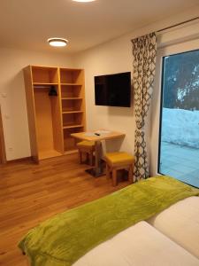 TV a/nebo společenská místnost v ubytování Appartement Kuschelzeit Jansenbichl