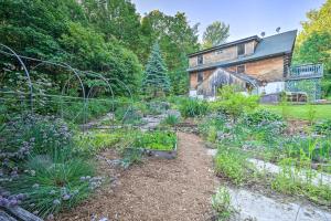a garden in front of a house at Game Room and Hot Tub Pet-Friendly Mount Snow Gem in Dover