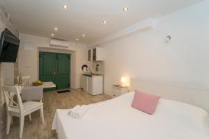 Posteľ alebo postele v izbe v ubytovaní Confluence Apartments