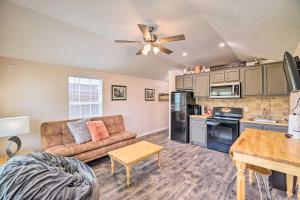 a living room with a couch and a table at Stylish Woodville Cabin Fishing Dock Access! in Woodville