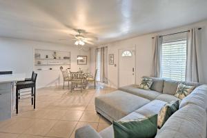 a living room with a couch and a table at Bright Naples Home - 4 Mi to Botanic Gardens! in Naples