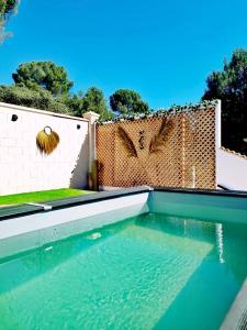 a swimming pool in front of a fence at Mirador del Lago in Córdoba