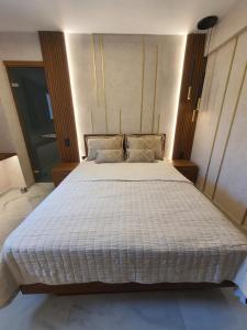 Posteľ alebo postele v izbe v ubytovaní Adell Miramare Golden Loft