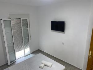 Televízia a/alebo spoločenská miestnosť v ubytovaní Casa Salma