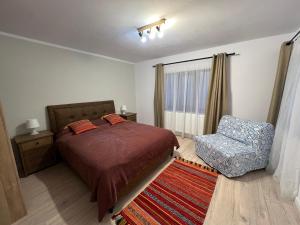 Postel nebo postele na pokoji v ubytování Casa Ana Corbșori