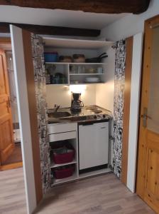 a kitchen with a counter and a sink at Ferienwohnung Gradeberg in Überlingen